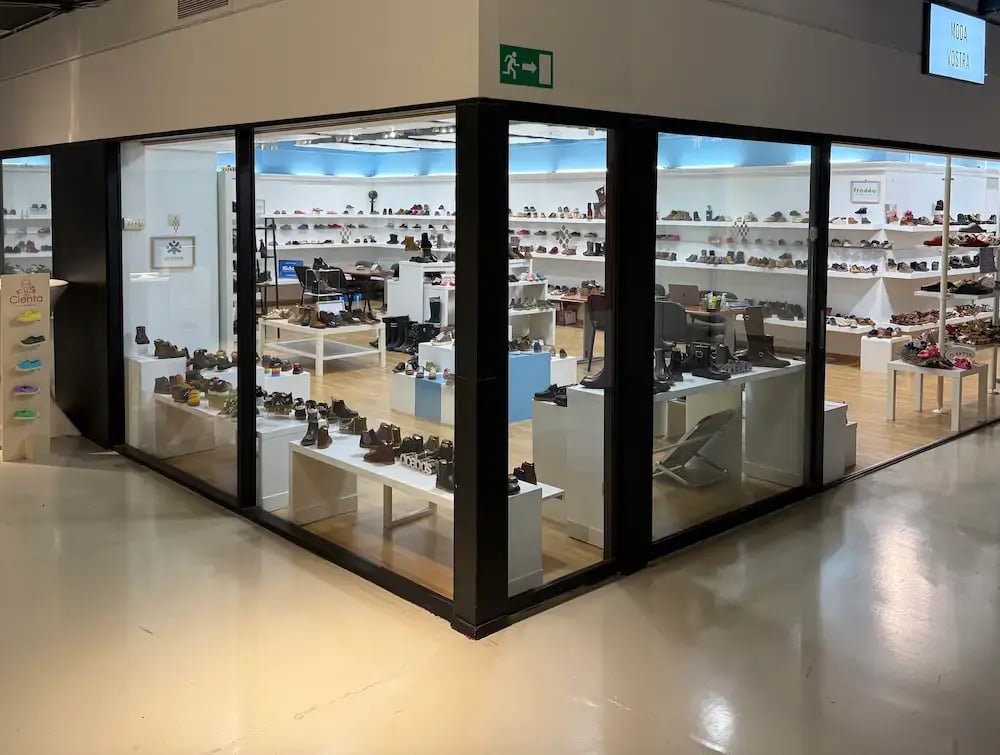 Window display of the Moda Vostra showroom at Trademart Brussels.